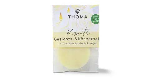Karité Gesichts- & Körperseife von THOMA – basische und vegane Naturseife ohne Duftstoffe, ideal für empfindliche Haut. Dezente Verpackung mit beruhigendem Design und sanfter Pflegewirkung.