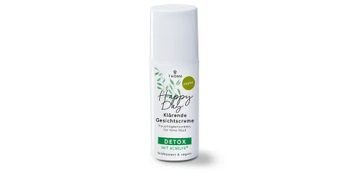 Eine Flasche der klärenden Gesichtscreme Happy Day Hafer von THOMA mit der Kennzeichnung Detox mit Acnilys Die Creme ist biobasiert und vegan spendet Feuchtigkeit und fördert reine Haut Nahaufnahme des Pumpspenders